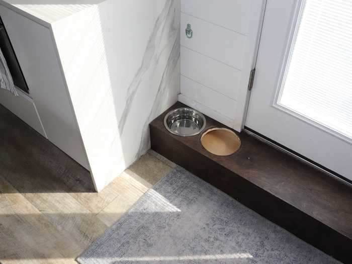 The step into her house doubles as a place to store her dog
