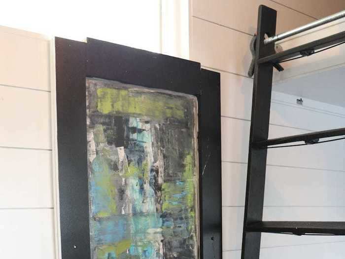 Burger even found an ingenious way to store her kitchen table — hidden behind a painting.