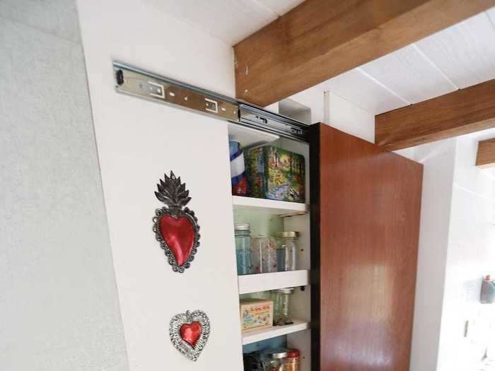 Christian Parsons and Alexis Stephens live in a 130-square-foot tiny house and have a pantry in their kitchen to store some of their food ...