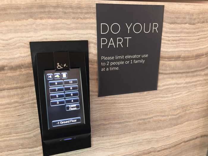 In the main elevator bank, you have to select your floor number on a keypad that will direct you to the corresponding elevator.