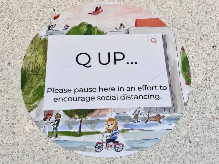 In the lobby leading up to the front desk, there were illustrated floor markers reminding guests to maintain social distancing while inside the hotel.