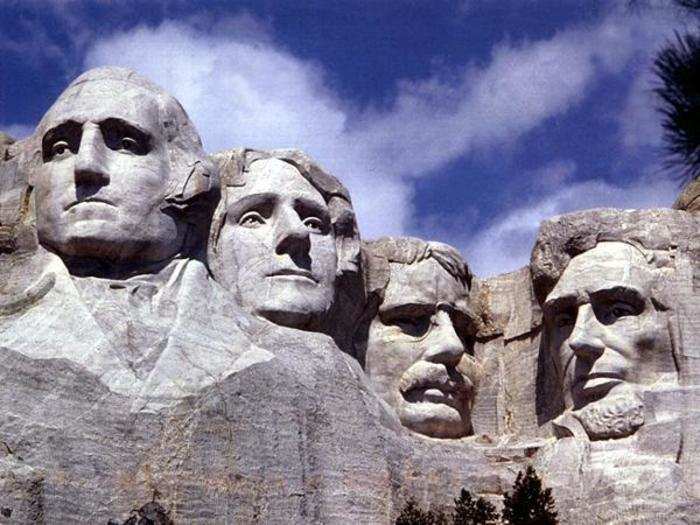 Close-up photos of the monument show the detailed features of each president