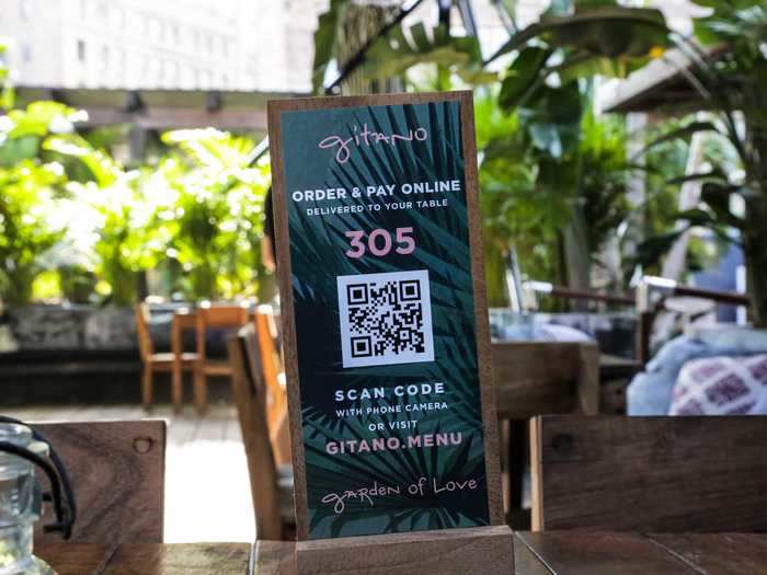 At the core of that reimagining: fully automating the dining experience. To order and pay, guests can use their phones to scan the QR code at their table.