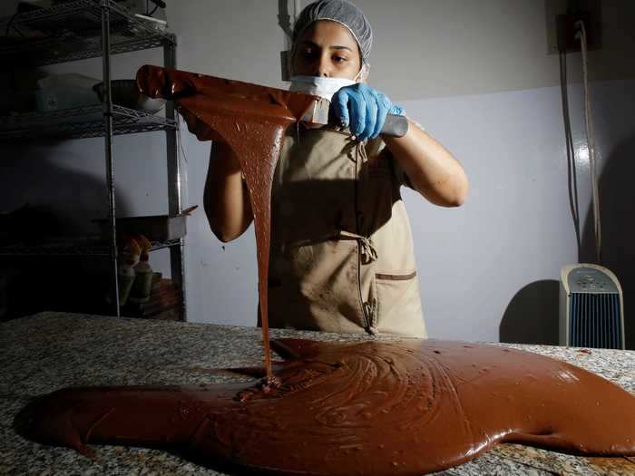 Chocolates are often prepared by hand, like at Nahua Chocolate Factory in Costa Rica.