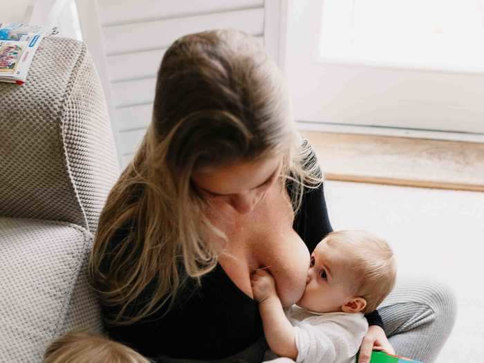 An older child may struggle at the beginning while their mom breastfeeds a new baby.