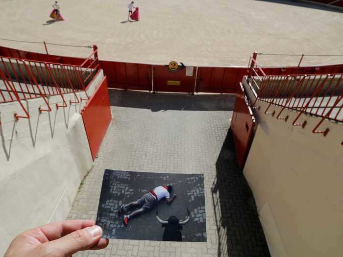 And here, a man is seen on the ground at the entrance of the ring as a bull comes running out.