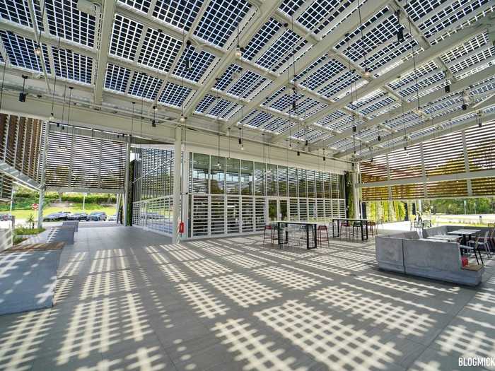 The outdoor seating areas are shaded by 1,500 square feet of solar glass, which can generate up to 70,000 kilowatts of electricity per year.