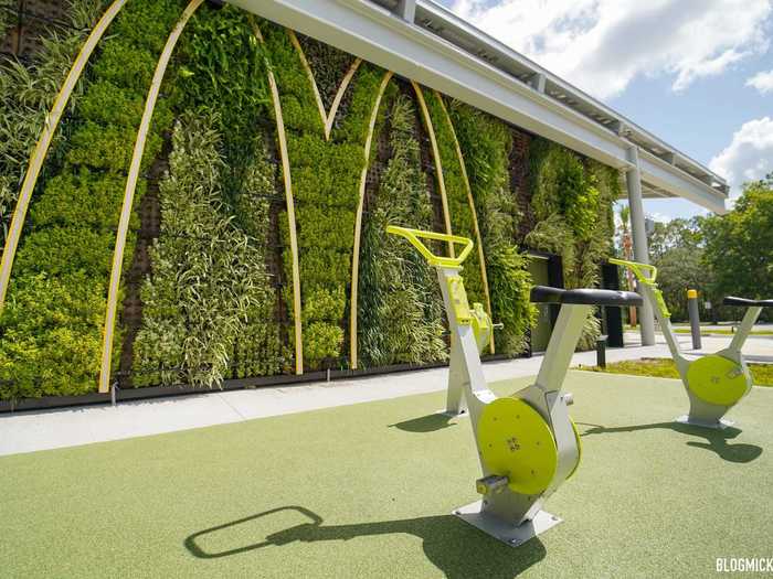 Customers can ride stationary bikes that generate electricity to light up the Golden Arches on the living wall.