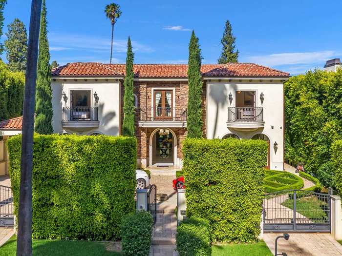 A Beverly Hills mansion is on the market for $18.7 million. The property is replete with some classic, sought-after features like a wine cellar and a waterfall — and some new coronavirus-era amenities, too.