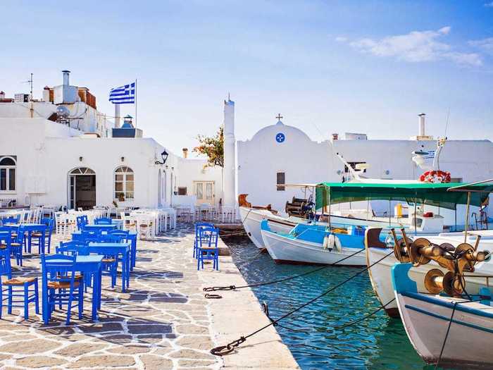 According to Travel + Leisure, the small fishing village of Naoussa is said to have "one of the most beautiful ports in Greece."