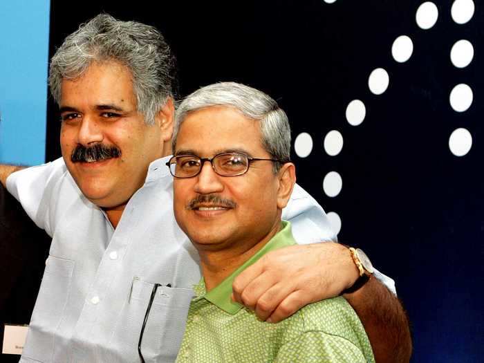 Rakesh Gangwal, right, graduated from Wharton in 1979. He grew US Airways