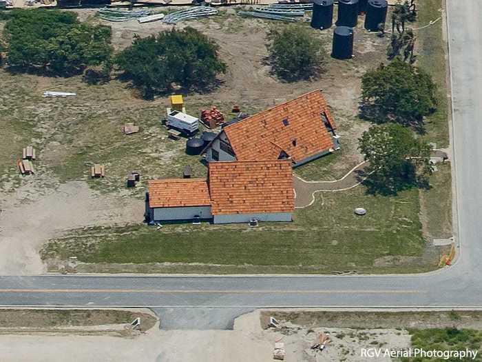 To the south of the Airstreams is a unique set of buildings: An A-frame house and guest house with an attached garage.