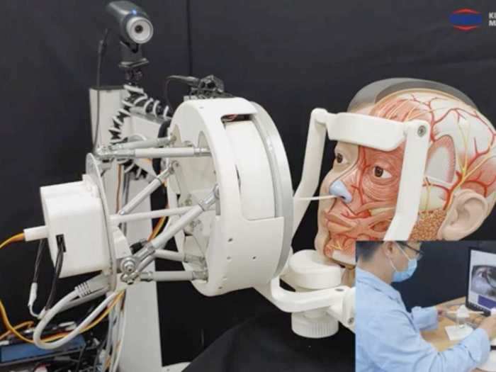 For the patient, the robot moves a disposable swab to take a sample through the nose.