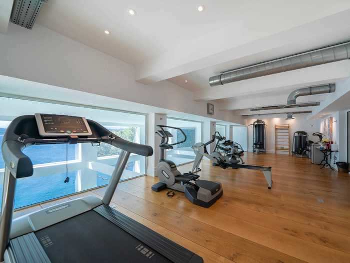 On a split level overlooking the swimming pool is a fully-equipped gym.