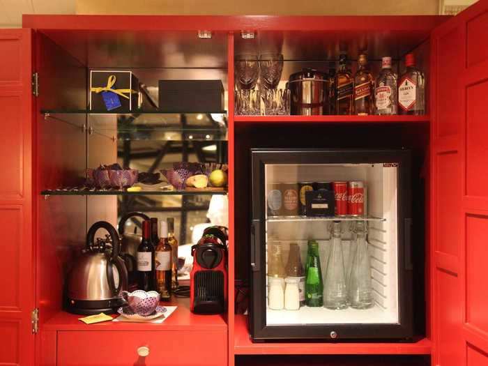 In addition to art, each suite is equipped with a not-so-mini bar stocked with complimentary alcohol, soda, snacks, and fix-ins for tea and coffee.