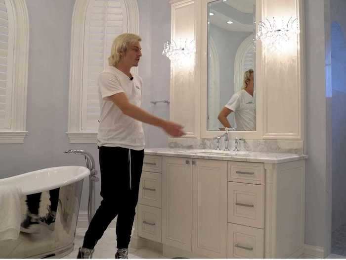 The master bath has two vanities, a separate tub and shower, toilet, and bidet.