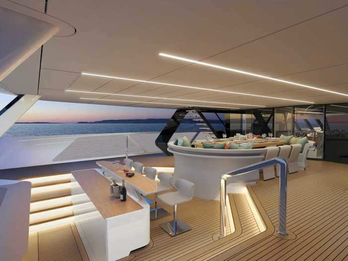 Outside, the main deck features a dining area for 12, a bar ...