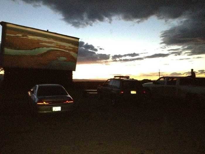 At this drive-in theatre, you can watch a movie from on a gigantic screen from your car and tune in to the film