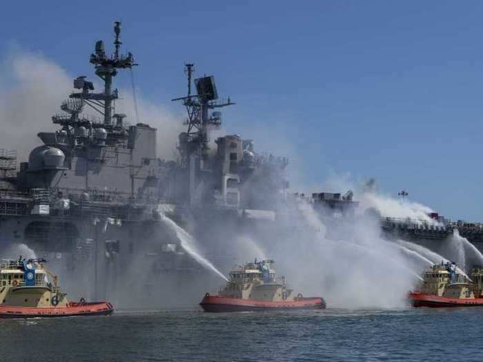 The Navy said Monday morning that 57 people, to include Navy sailors and civilians, have been treated for minor injuries, to include heat exhaustion and smoke inhalation. Five people remain hospitalized.