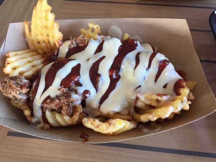 NORTH CAROLINA: The barbecue "nachbros" at Bros Sandwich Shack in Avon, North Carolina, are crunchy waffle fries completely coated in slow-roasted pulled pork, barbecue sauce, and smoked gouda cheese sauce.