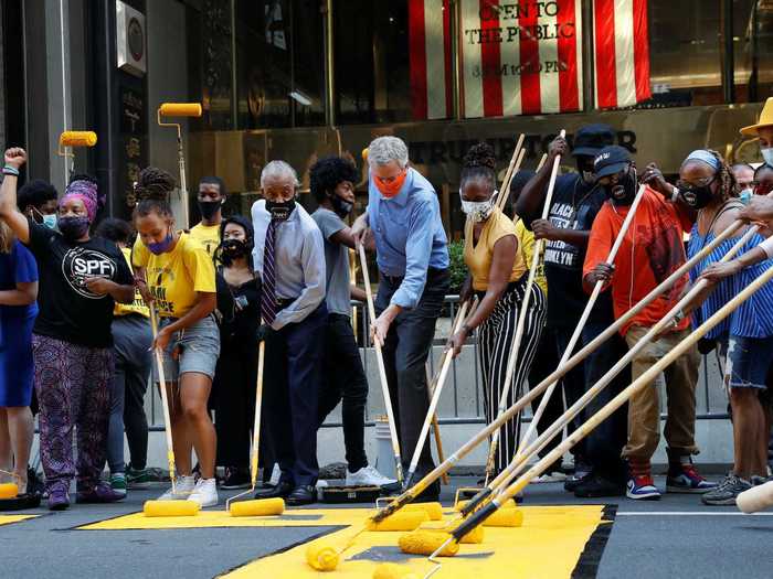 New York City Mayor Bill de Blasio even helped activists put on some finishing touches to the mural.