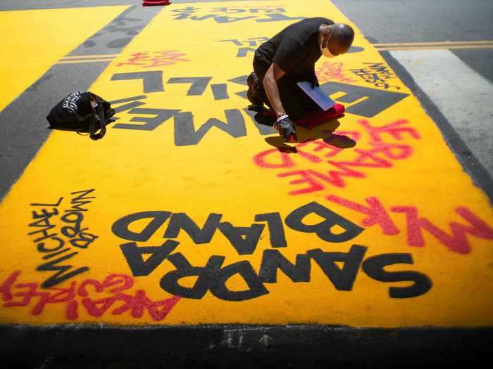 Along the mural, the names of Black activists and people who have died from police violence were spray painted within the letters.