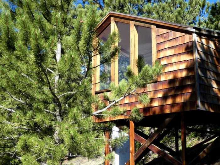 This secluded tiny house on private property in Colorado sits at an elevation of 9,000 feet, boasts sweeping views of the surrounding mountains, and connects to a network of hiking trails.