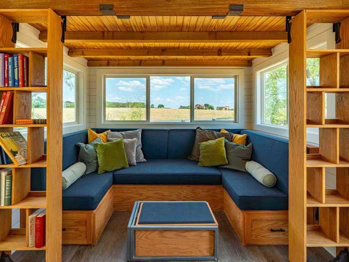 Travelers who book this tiny house in Texas Hill Country near the Colorado River can stare out over the prairie from a wood-paneled sitting room, then take a dip in the shared pool to cool off from the Texas heat.