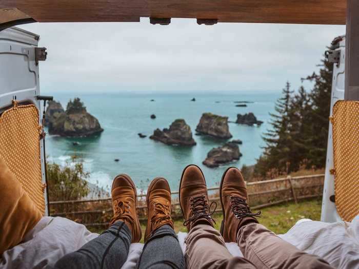 The back of the van opens up so the couple can enjoy the views as they travel.