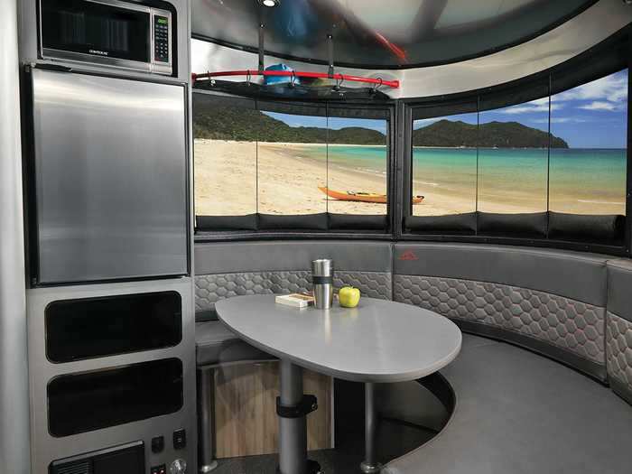 The updated refrigerator sits beside the new U-shaped dinette area that can seat four adults.