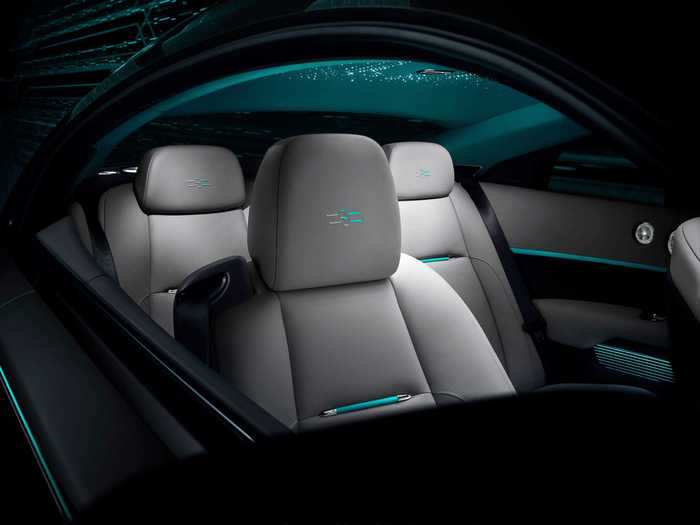 The perplexing designs continue to the interior. Parts of the cipher are stitched into the headrests where the Rolls-Royce emblem would normally be found — that