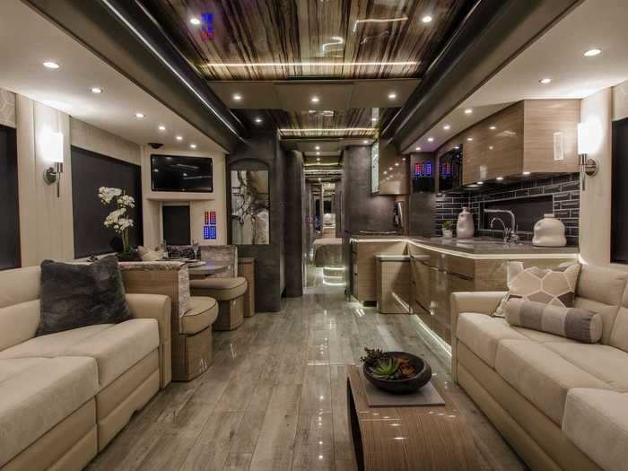 The RV has a lavishly designed full bedroom and bathroom.