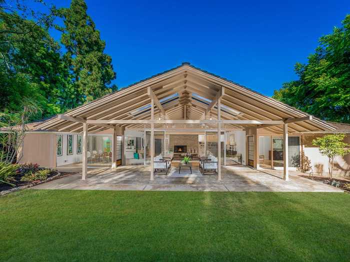 The veranda is covered by a skylit beamed ceiling, perfect for stargazing.