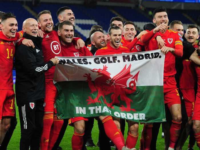 As put it so well on a flag he held after Wales beat Hungary in 2019: "Wales. Golf Madrid. In that order."