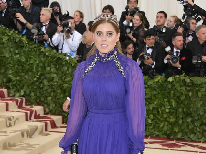 She attended the 2018 Met Gala in a regal purple dress with embellished neck and shoulder pieces.