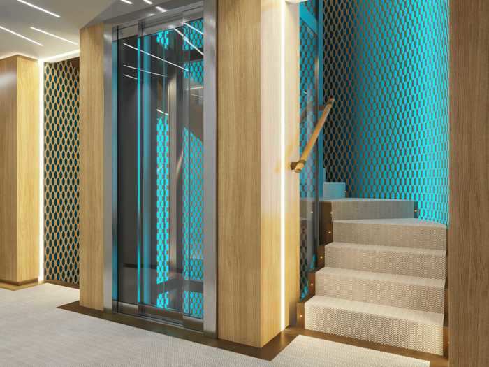 A glass elevator takes guests between the ship