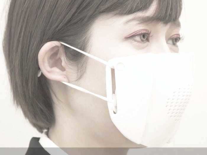 The C-Mask is worn over a typical face mask, which holds up the smart mask with its straps.