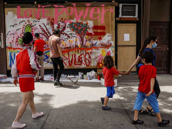 Some artists in the Bowery neighborhood told Reuters that they asked businesses for permission to paint on their boards.