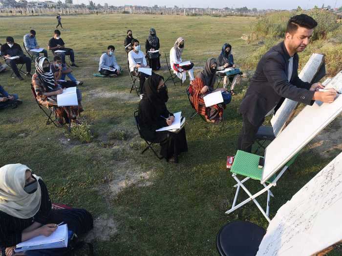 In the Kashmir Valley, these students are practicing social distancing, wearing masks, and getting fresh air, all while learning some math.