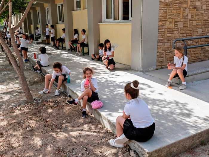 Keeping your distance, even when outside, also helps avoid spreading the virus, as these kids in Cyprus seem to know.