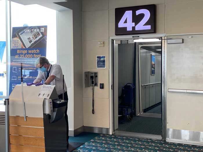 Flyers were asked to scan their own boarding pass at the podium equipped with a passenger-facing scanner and hand sanitizer station. We boarded the aircraft back to front and in groups of five rows.