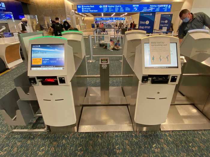 Self-check-in kiosks were spaced with the middle in a row of three blocked off for use.