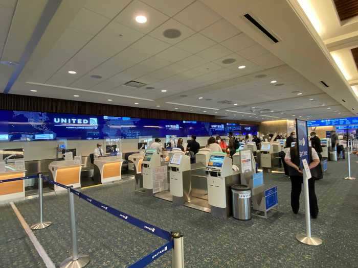 The check-in area featured some safety features including plexiglass partitions between passengers and staff at the counter.