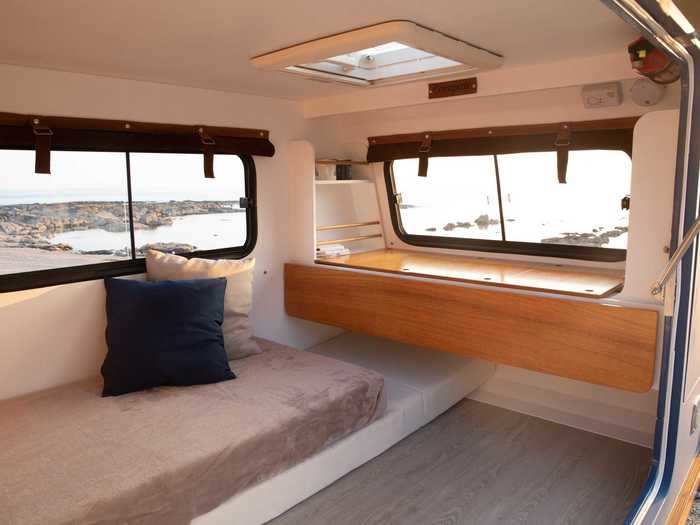 Natural light enters the trailer through three sliding windows and a skylight, the later of which has blackout blinds and a mosquito net. Blackout blinds, insulating curtains, and a tinting treatment for the other windows are included in the moon and sunglasses backpack.