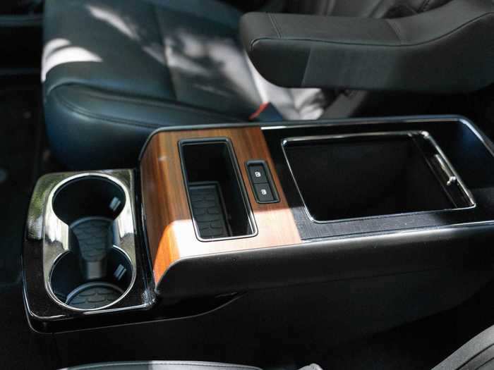 The optional middle-row center console has additional cup holders and rubber-lined cubbies.