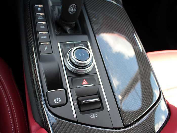 Touchscreen functionality is supported by a limited knob-and-button selector. Note the switch that raises and lowers the Levante