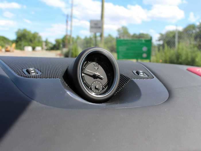 A well-designed clock and stopwatch takes up pride-of-place in the middle of the dashboard.