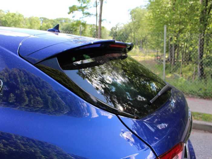 The coupé-style fastback roof slopes to an integrated spoiler.