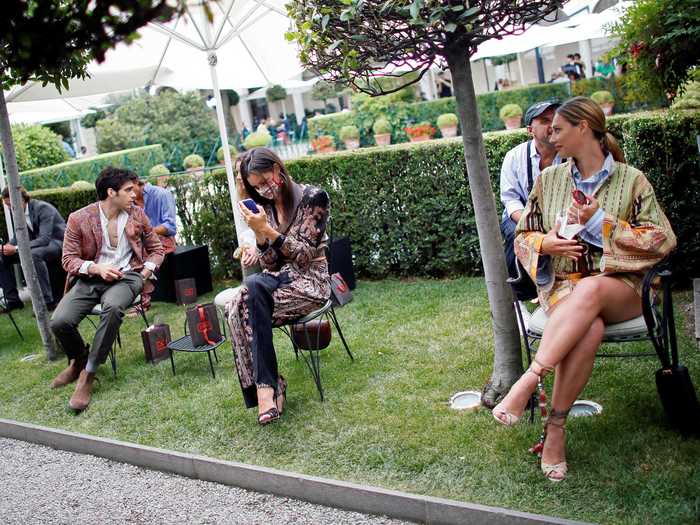 Models displayed their looks outdoors, and the guests sat at least six feet apart.