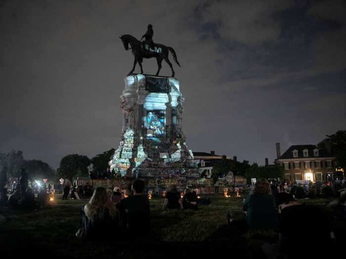 Here, an image of Frederick Douglass, a leading abolitionist who escaped slavery, is seen projected onto the statue